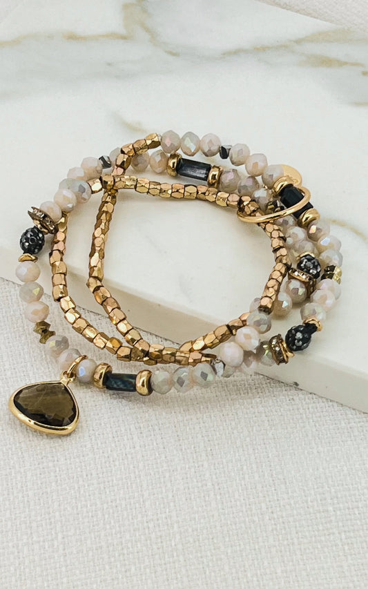 EnvyGold nude and black triple layer stretch bracelet with crystal pendant