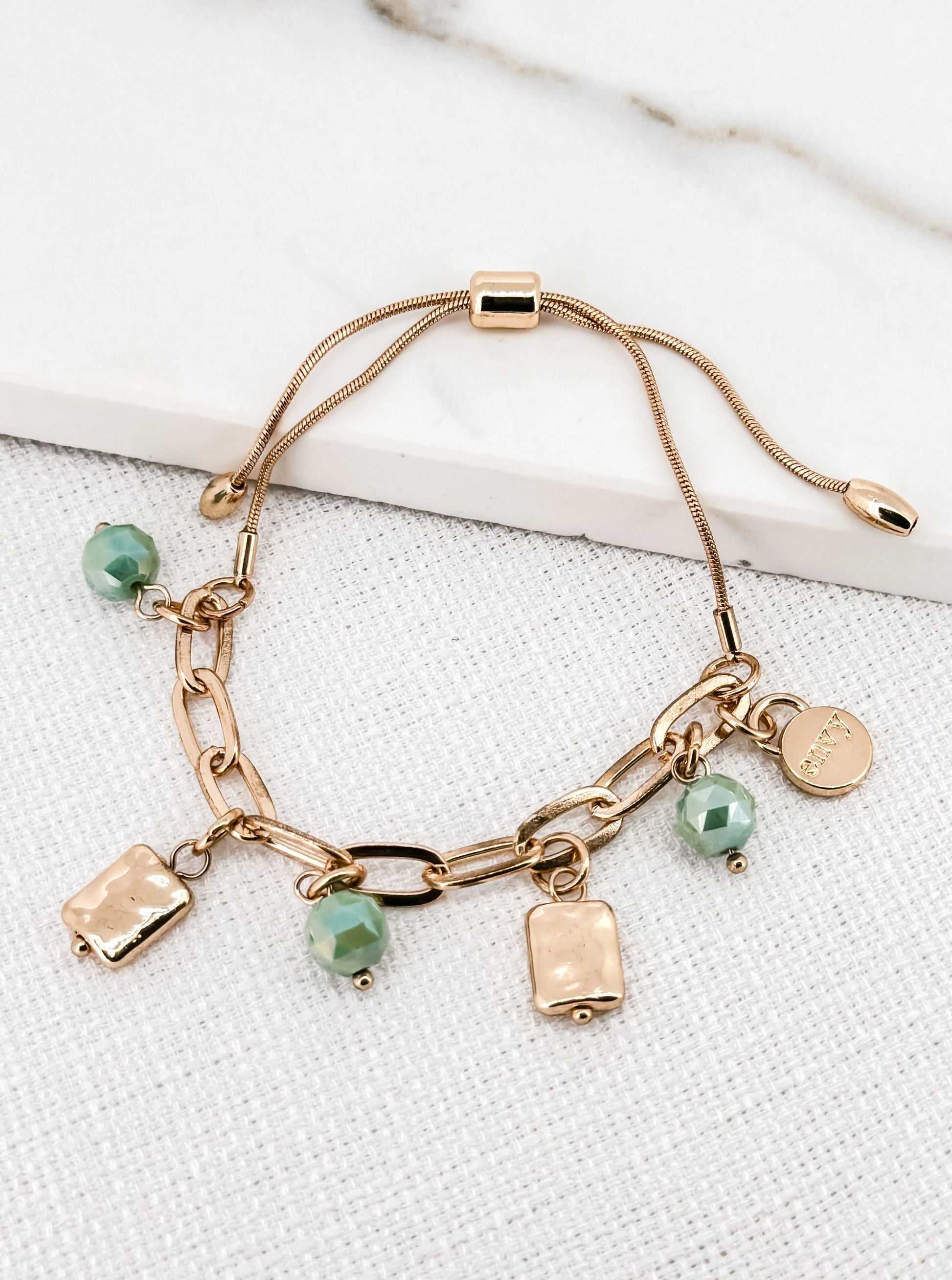 Envy Gold Charm Bracelet with Green Glass Beads