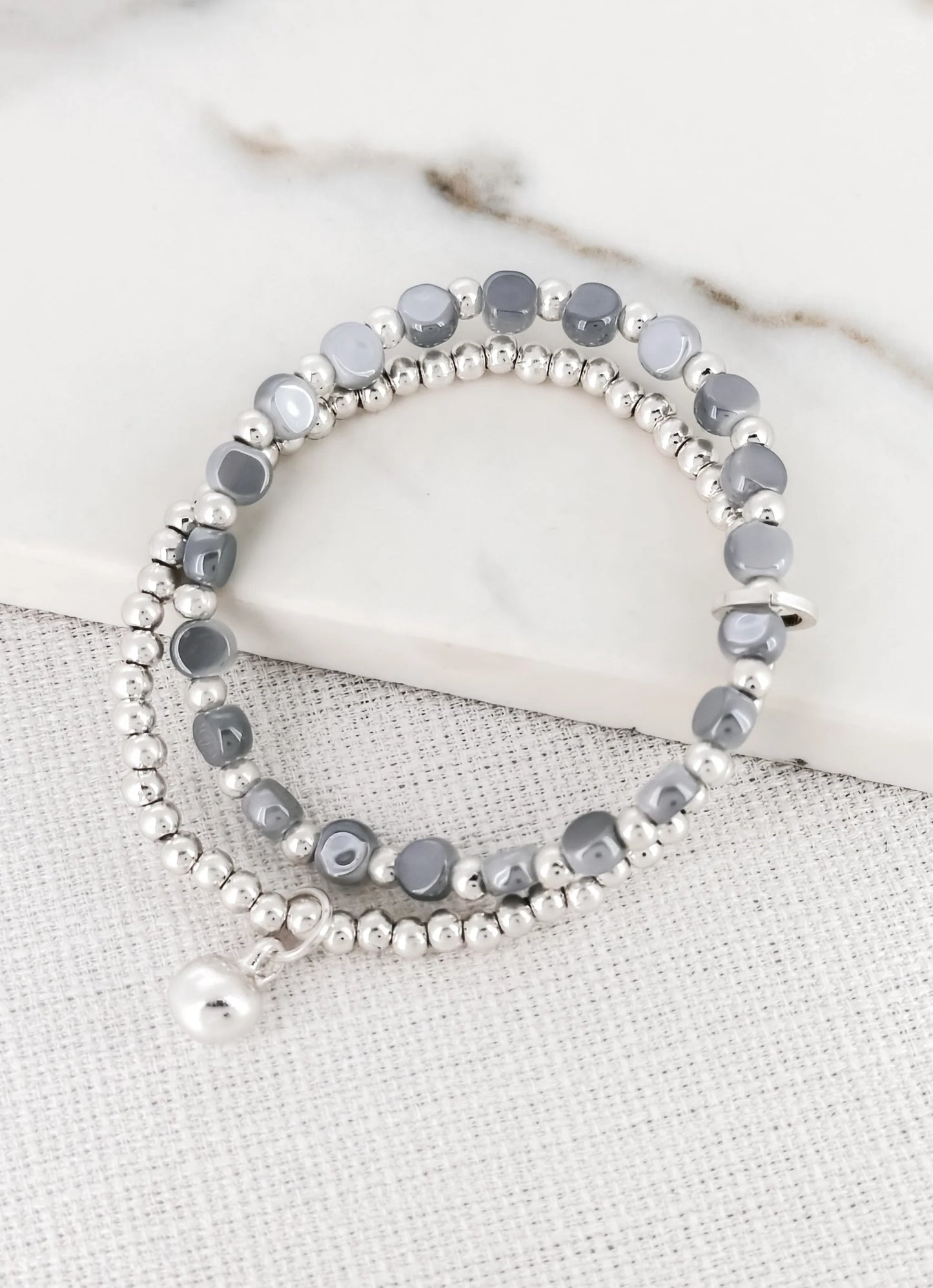 Envy Double Layer Silver and Blue Bead Bracelet with a Ball Charm